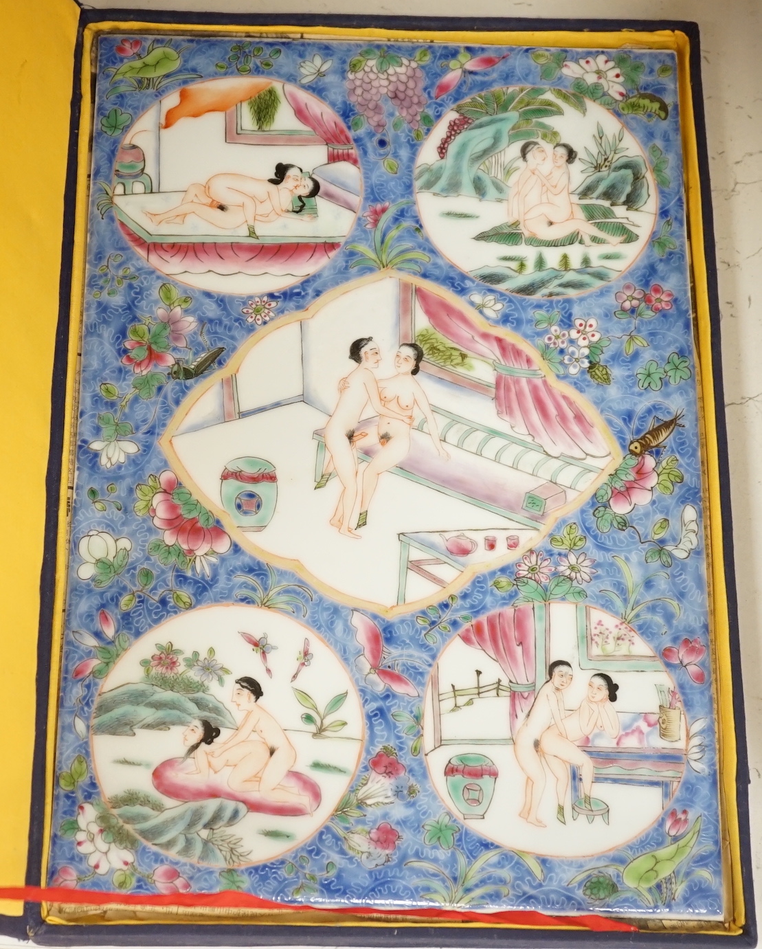 A cased Chinese enamelled porcelain erotic tile, 25cm wide, 36.5cm high